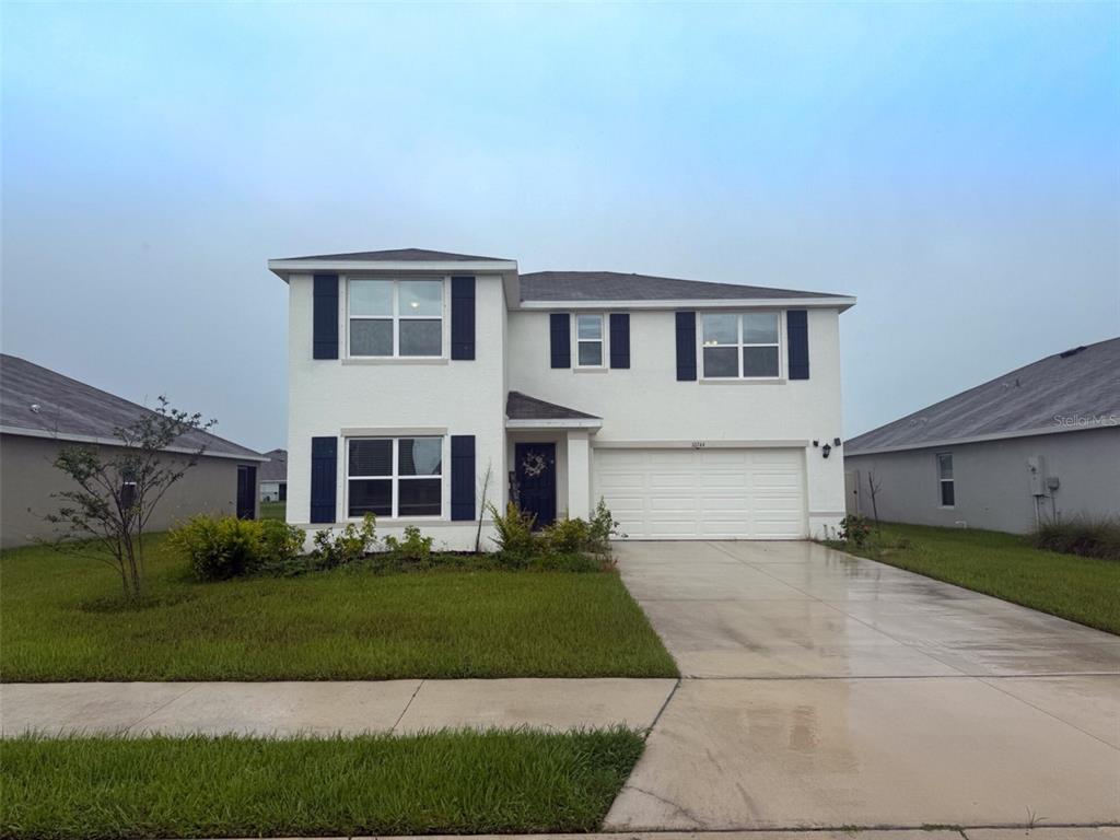 10744 Chippewa Drive Parrish, FL 34219 - Photo 1 of 1 a house view with a garden space