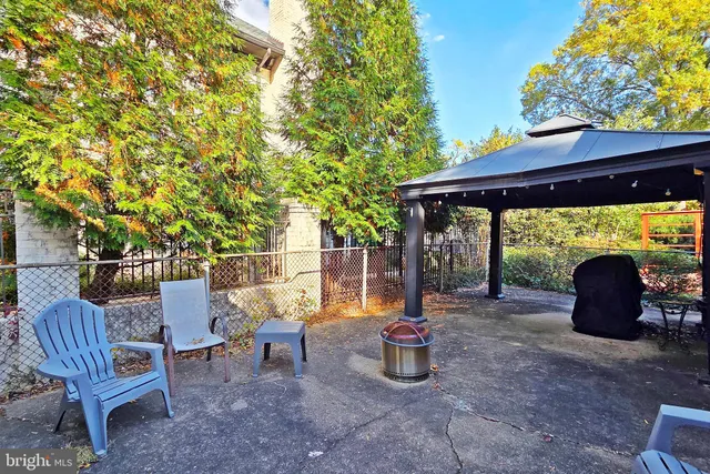 a view of a chairs and table in the patio