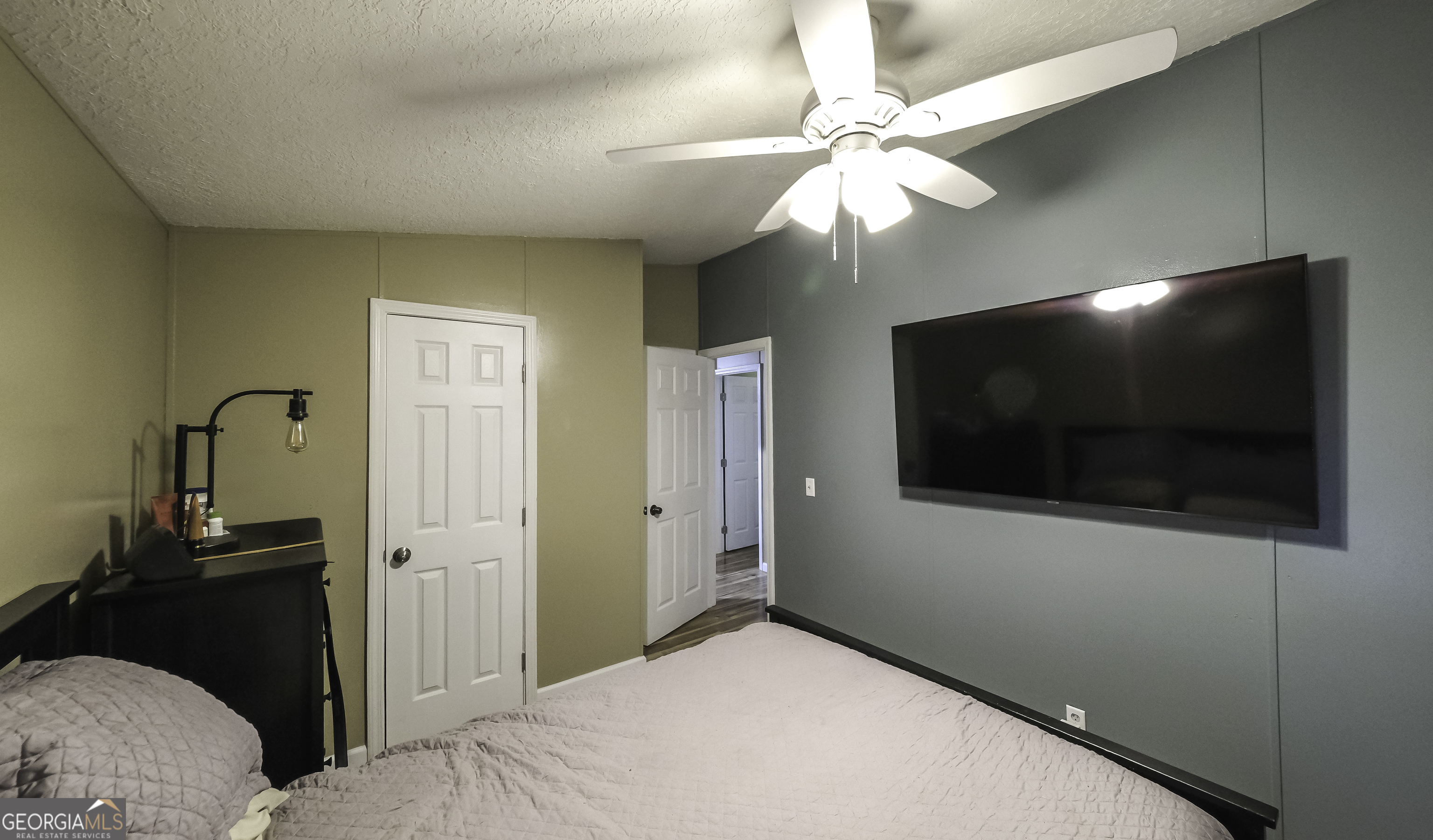 91 Holder Road Temple, GA 30179 - Photo 29 of 40 a bedroom with a bed and a flat screen tv