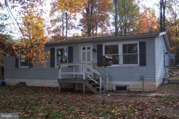 732 Shades Road Berkeley Springs, WV 25411 - Photo 2 of 8 a view of a house with a yard