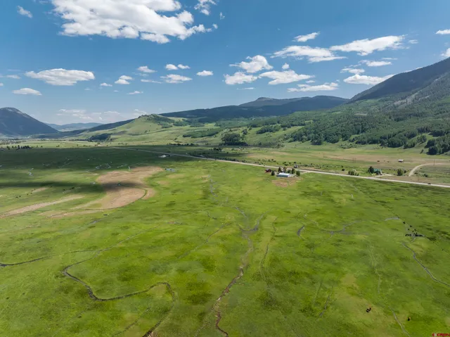 a view of an ocean and a yard