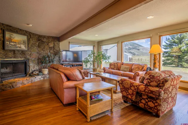 a living room with furniture and a large window