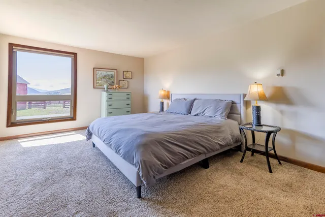 a bathroom with a double vanity sink toilet and shower