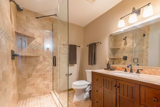 a bedroom with a bed lamps and window