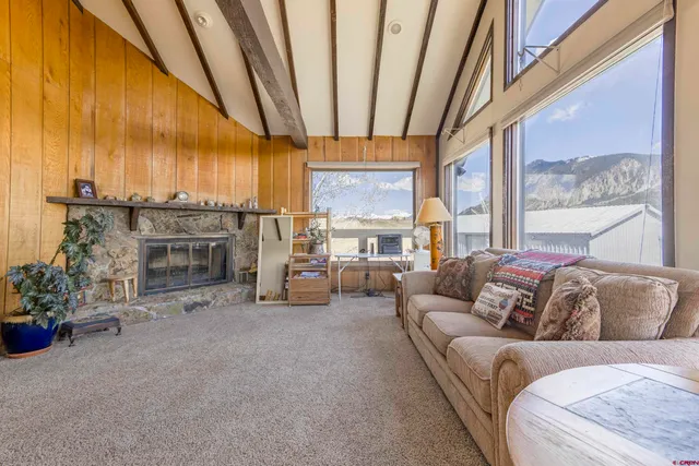 a bathroom with a granite countertop tub a sink and a large mirror