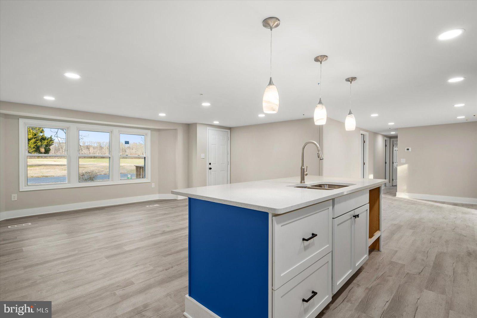36451-3 3 Bridges Road Willards, MD 21874 - Photo 12 of 44 a kitchen with a sink cabinets and wooden floor