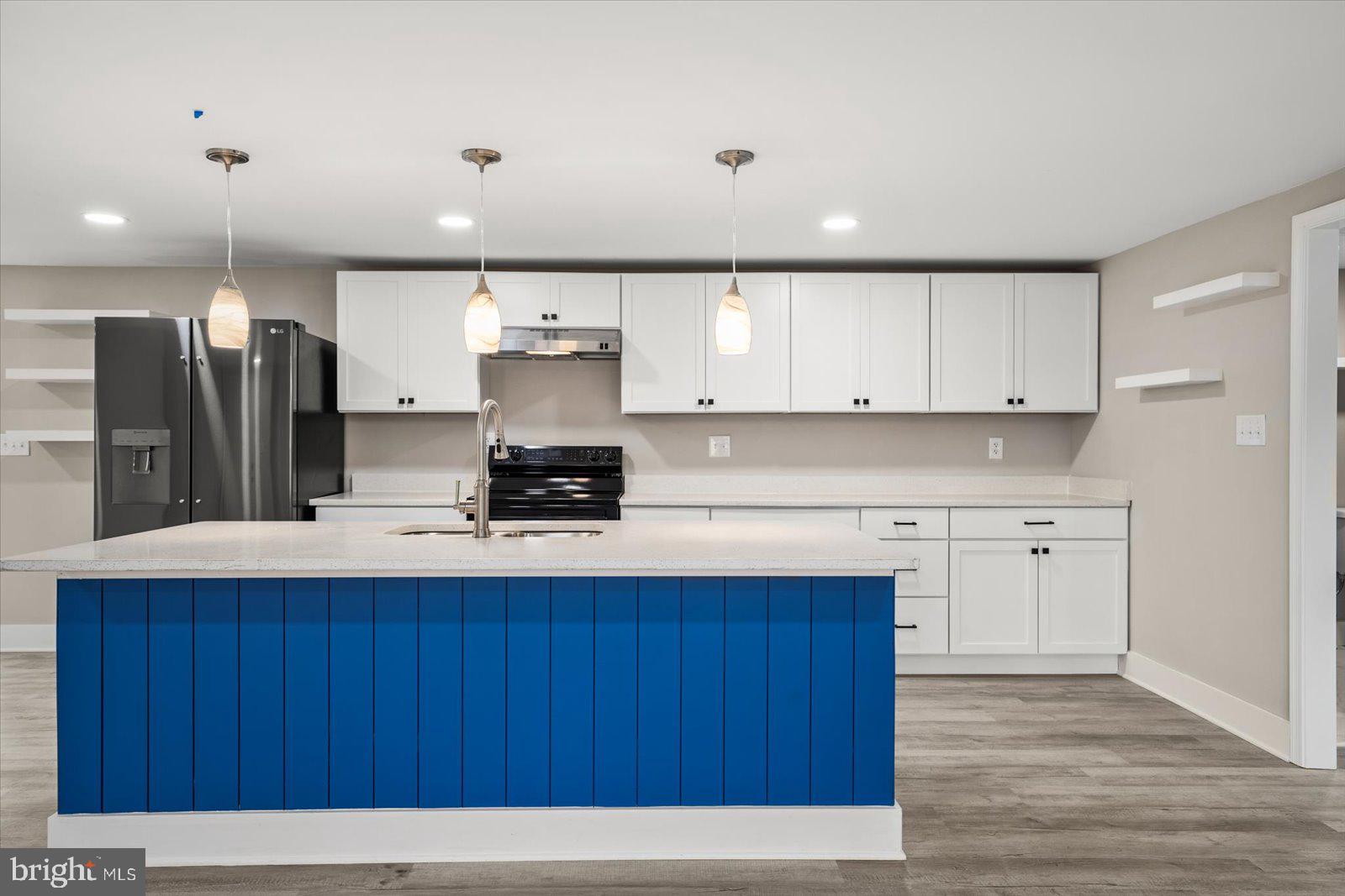 36451-3 3 Bridges Road Willards, MD 21874 - Photo 13 of 44 a kitchen with cabinets and stainless steel appliances