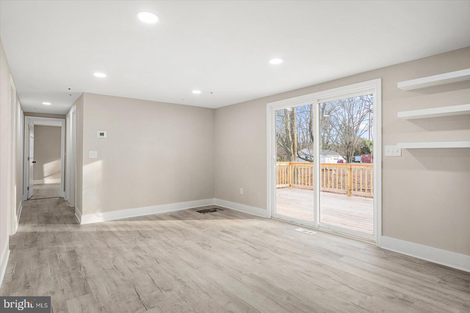36451-3 3 Bridges Road Willards, MD 21874 - Photo 16 of 44 wooden floor in an empty room with a window