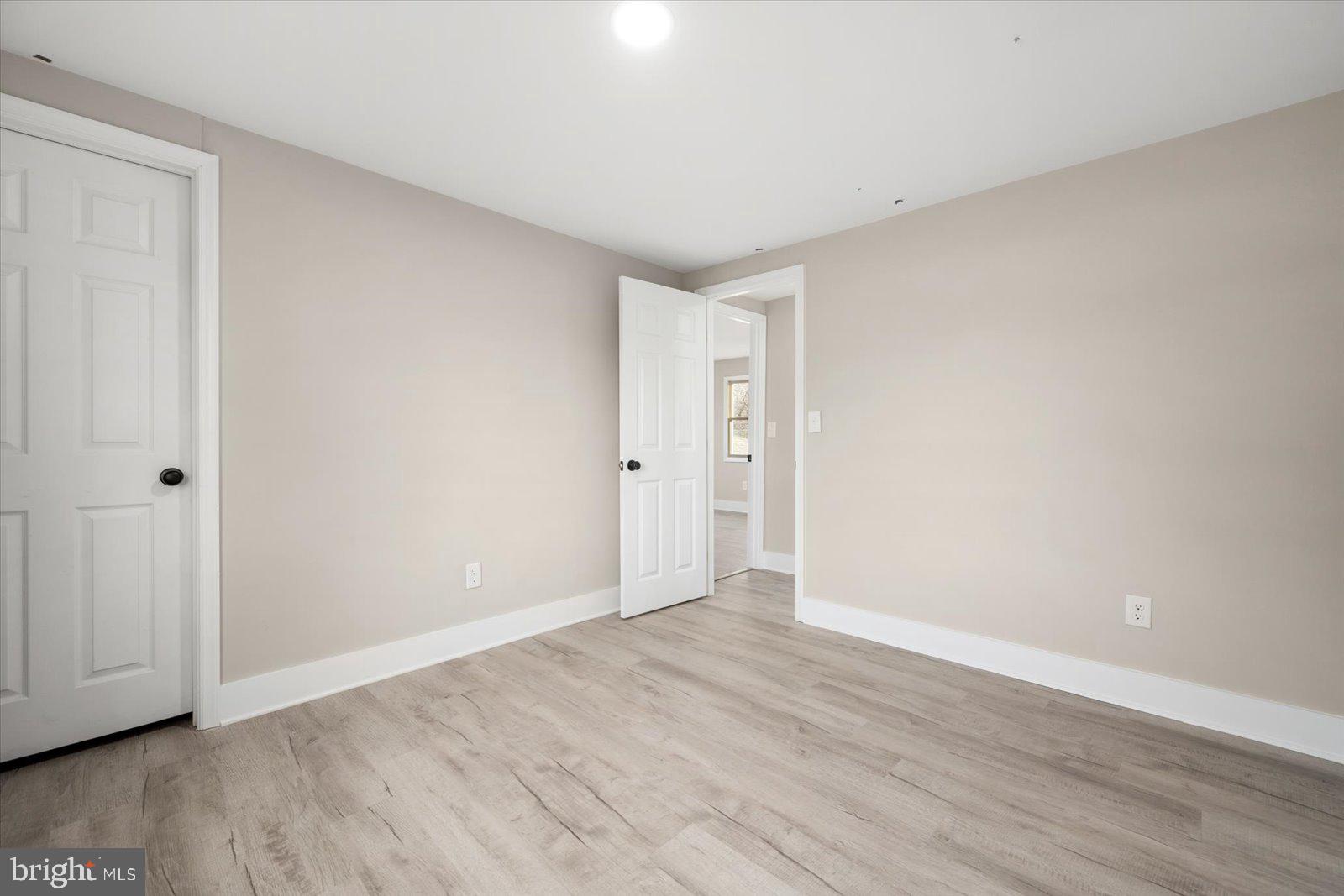 36451-3 3 Bridges Road Willards, MD 21874 - Photo 25 of 44 a view of an empty room with wooden floor