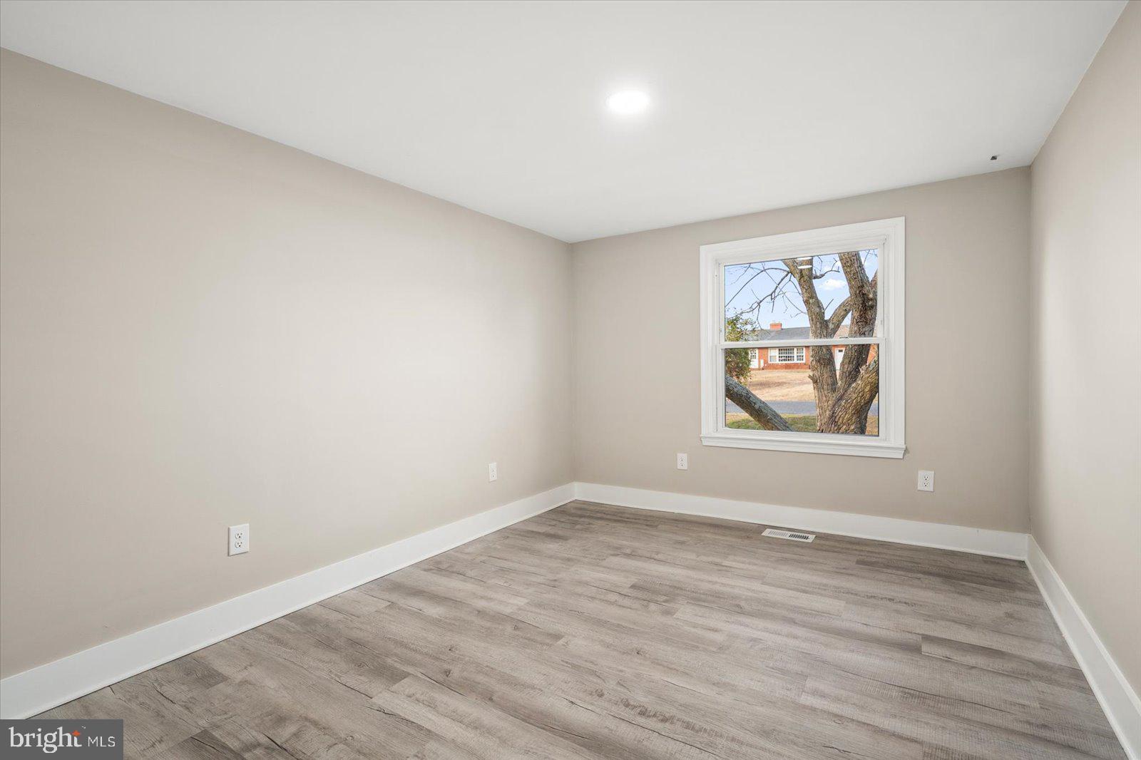 36451-3 3 Bridges Road Willards, MD 21874 - Photo 27 of 44 wooden floor in an empty room with a window