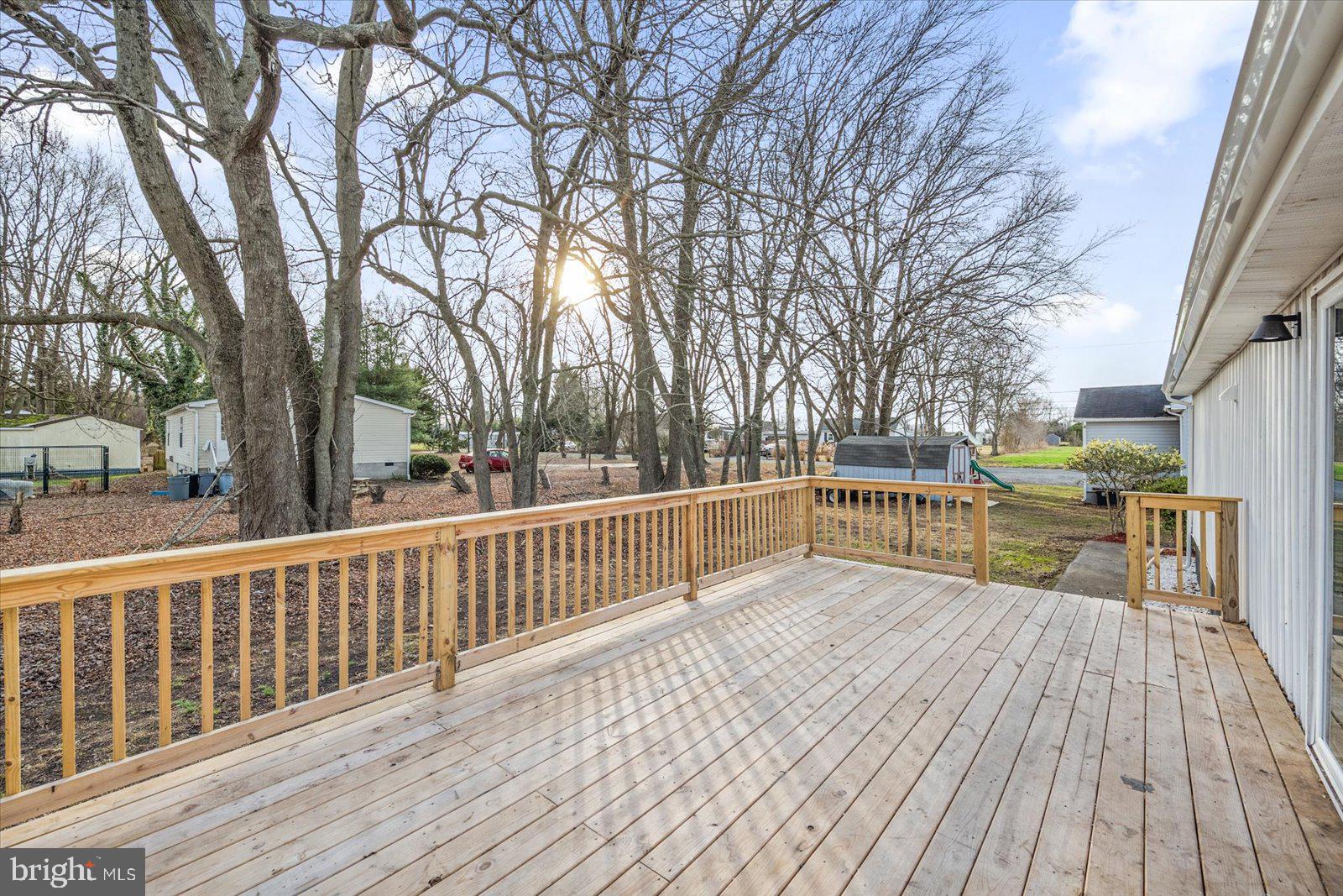 36451-3 3 Bridges Road Willards, MD 21874 - Photo 35 of 44 a view of balcony with deck and wooden floor