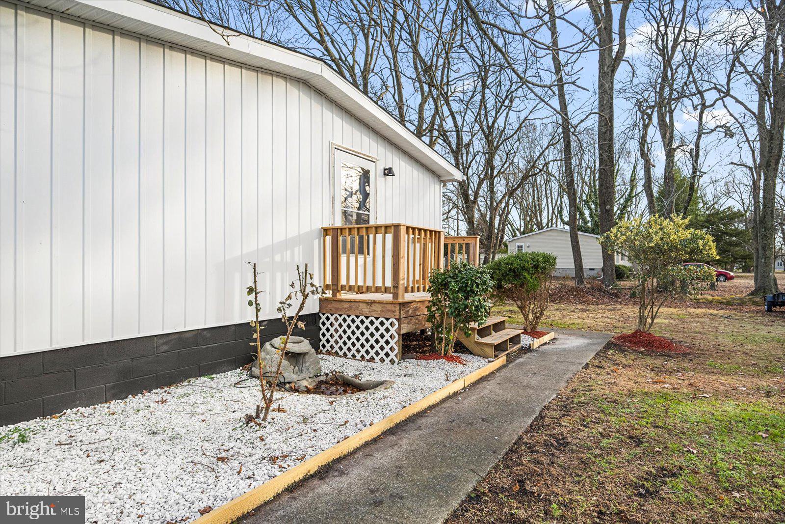 36451-3 3 Bridges Road Willards, MD 21874 - Photo 42 of 44 a front view of a house with garden