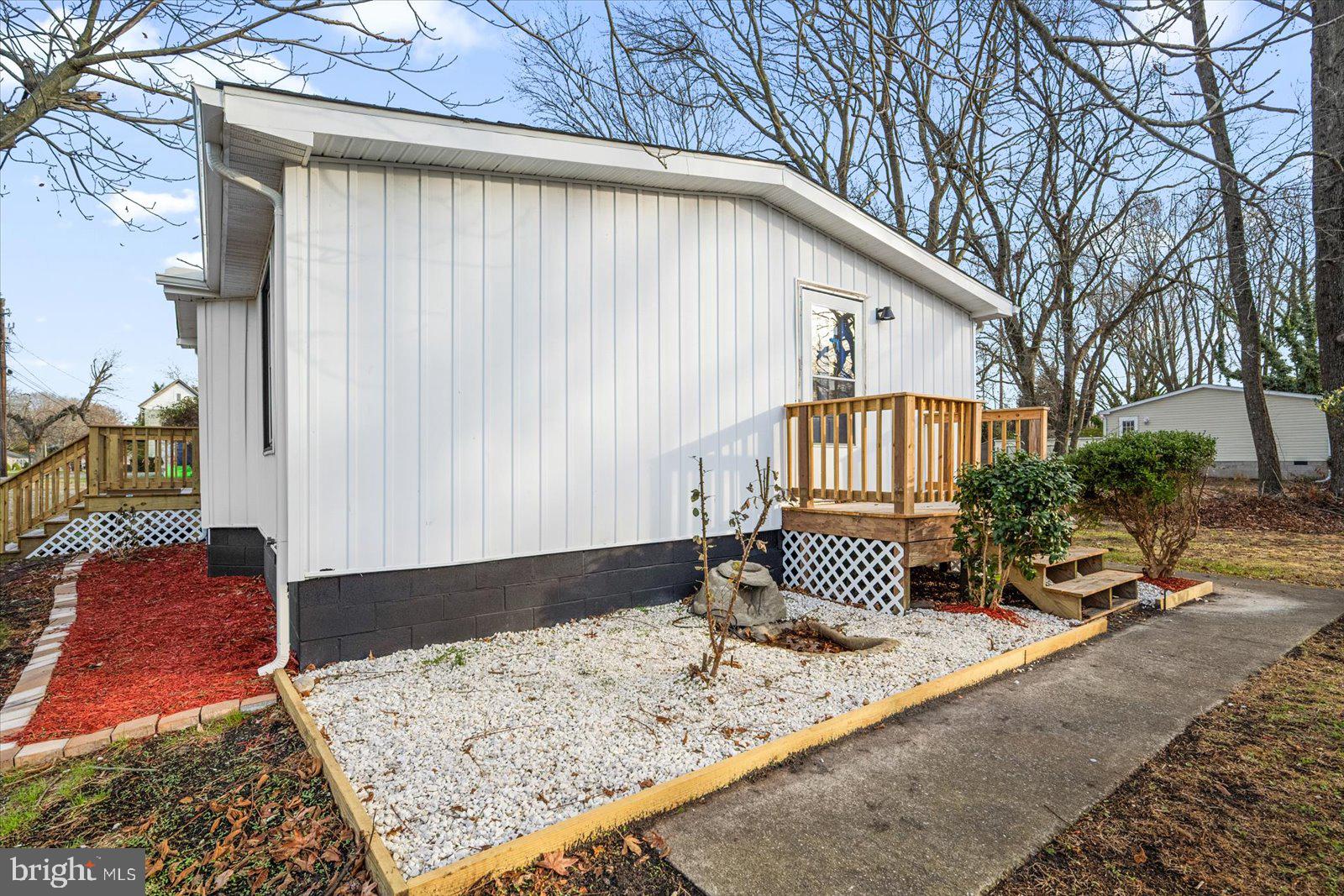 36451-3 3 Bridges Road Willards, MD 21874 - Photo 43 of 44 a front view of a house with garden