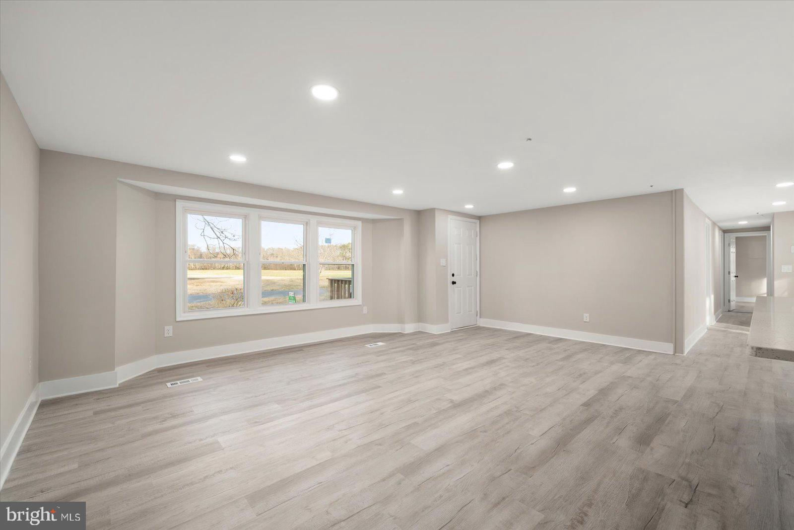 36451-3 3 Bridges Road Willards, MD 21874 - Photo 5 of 44 a view of an empty room with a window