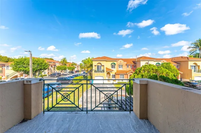 a view of a backyard with swimming pool