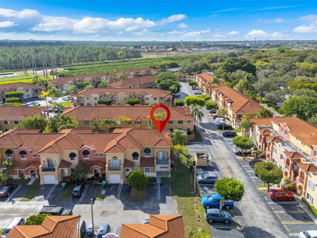 an aerial view of a city with lake view