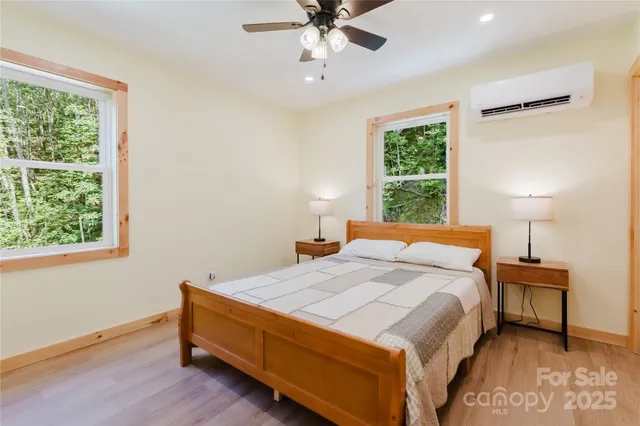 a bedroom with a bed and window