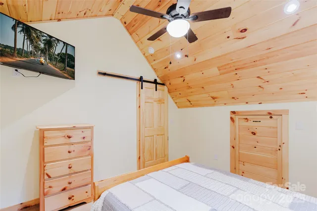 a bedroom with a bed and a cabinets