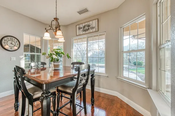 a kitchen with stainless steel appliances granite countertop a stove sink and cabinets