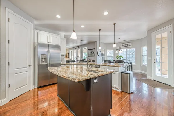 a bedroom with a bed dresser and a window