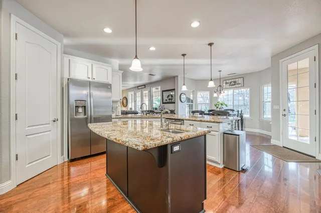 a bedroom with a bed dresser and a window