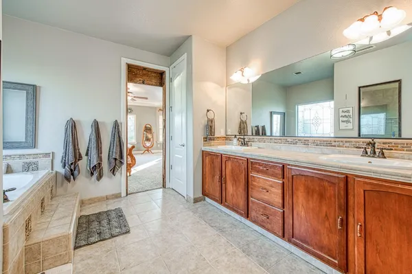 a bathroom with a sink double vanity and a mirror