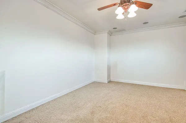 a bathroom with a granite countertop sink a toilet a mirror and shower