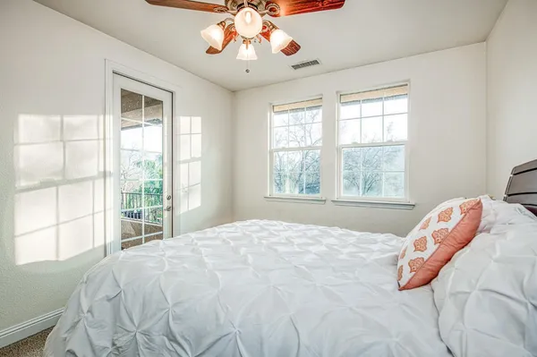 a view of a house with a yard and garage