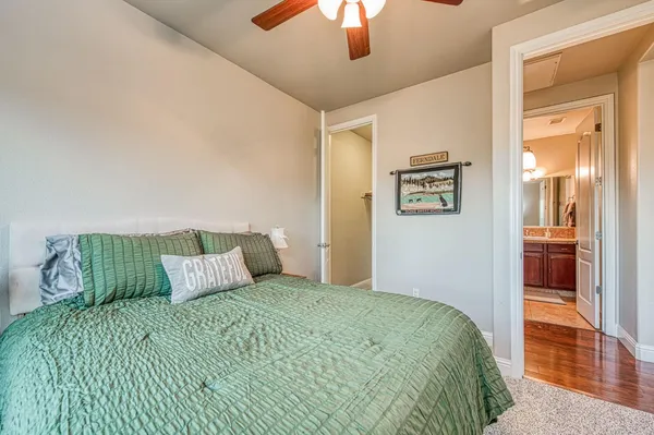 a front view of a house with a garden and yard