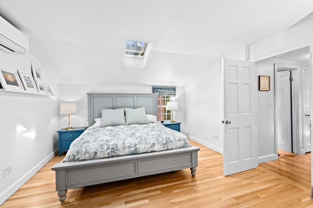 23 Mast Hill Road Hingham, MA 02043 - Photo 24 of 42 a bedroom with a bed and painting on the wall