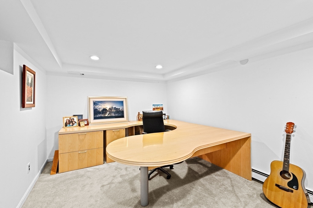 23 Mast Hill Road Hingham, MA 02043 - Photo 34 of 42 a living room with furniture and a flat screen tv