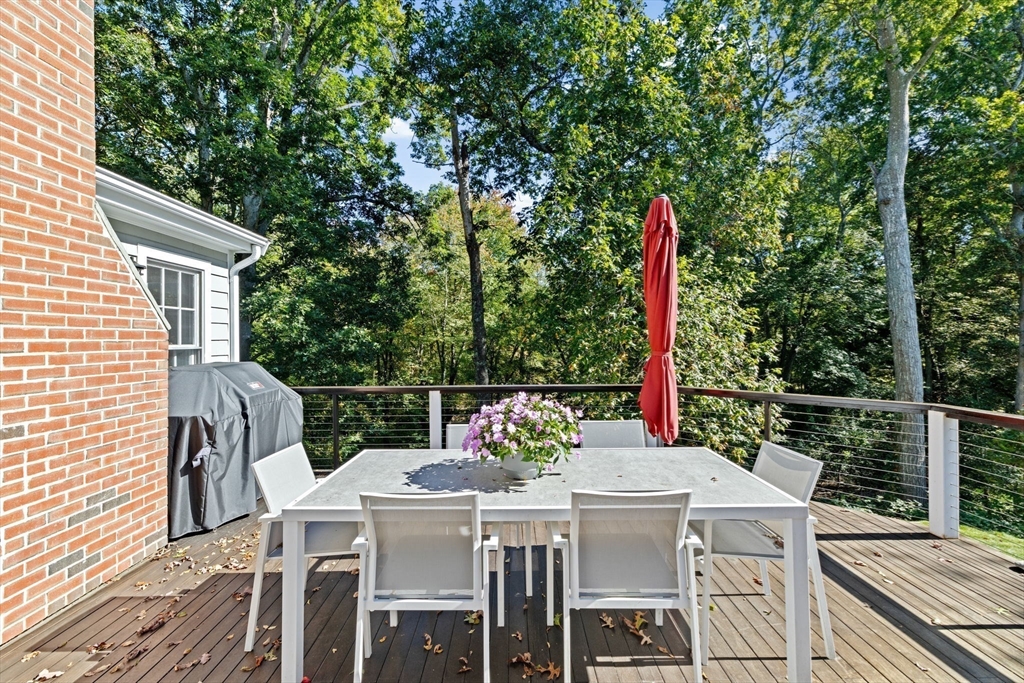 23 Mast Hill Road Hingham, MA 02043 - Photo 36 of 42 a view of a patio with a table and chairs