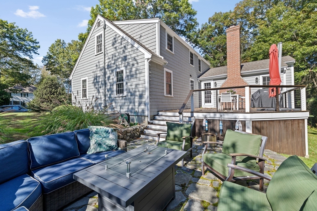 23 Mast Hill Road Hingham, MA 02043 - Photo 37 of 42 a view of a patio with couches table and chairs and potted plants