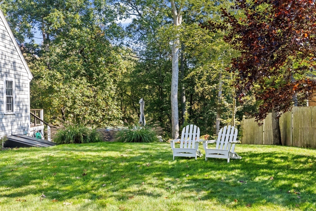 23 Mast Hill Road Hingham, MA 02043 - Photo 39 of 42 a view of a table and chairs in the garden