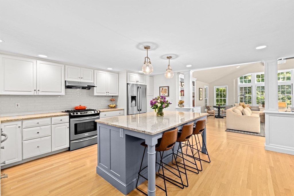 23 Mast Hill Road Hingham, MA 02043 - Photo 6 of 42 a large kitchen with cabinets table and chairs
