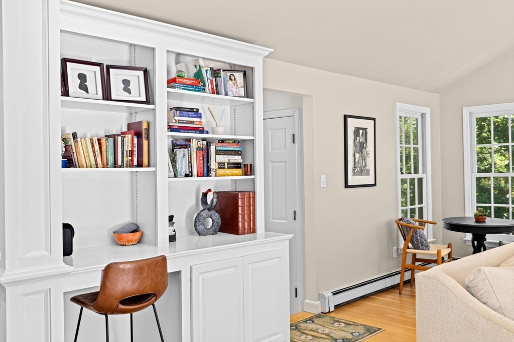 23 Mast Hill Road Hingham, MA 02043 - Photo 8 of 42 a living room with furniture and a book shelf