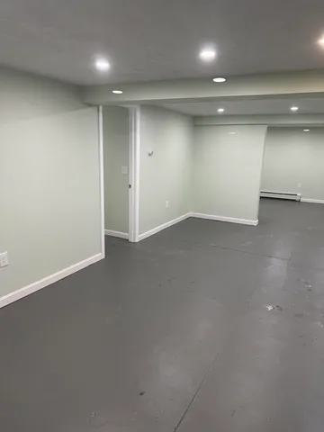 an empty room with a empty space and windows