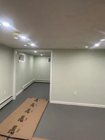 an empty room with wooden floor