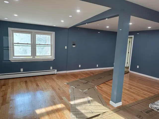 a view of a livingroom with wooden floor