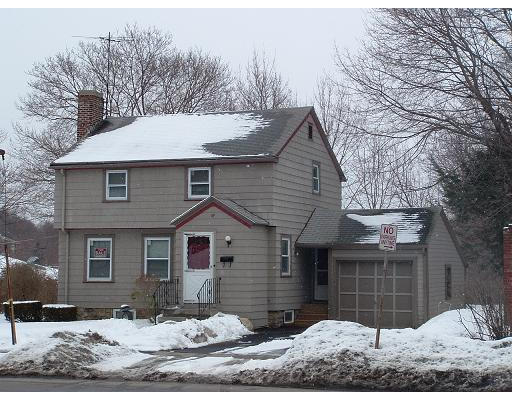 69 Park Avenue Worcester, MA 01605 - Photo 1 of 7 a front view of a house with a yard covered in snow