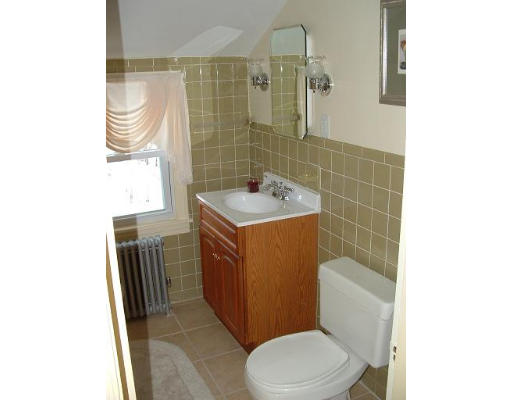 69 Park Avenue Worcester, MA 01605 - Photo 6 of 7 a bathroom with a sink a toilet and shower