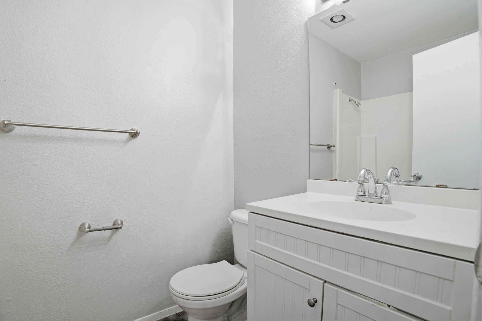 5204 Nuckols Crossing Road, Unit B Austin, TX 78744 - Photo 6 of 16 a bathroom with a sink a toilet and vanity