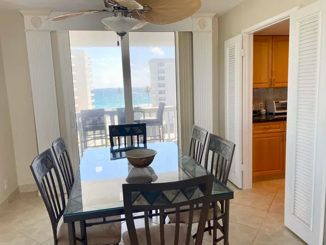 a view of a dining room with furniture window and outside view