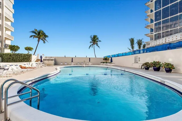 a view of swimming pool with a lounge chair