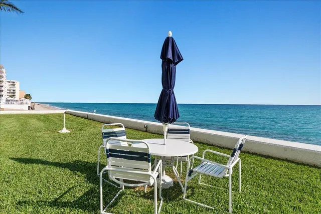 a view of a table and chairs in the garden