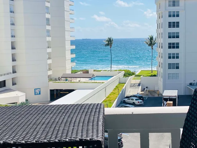 a view of a swimming pool with a lounge chairs