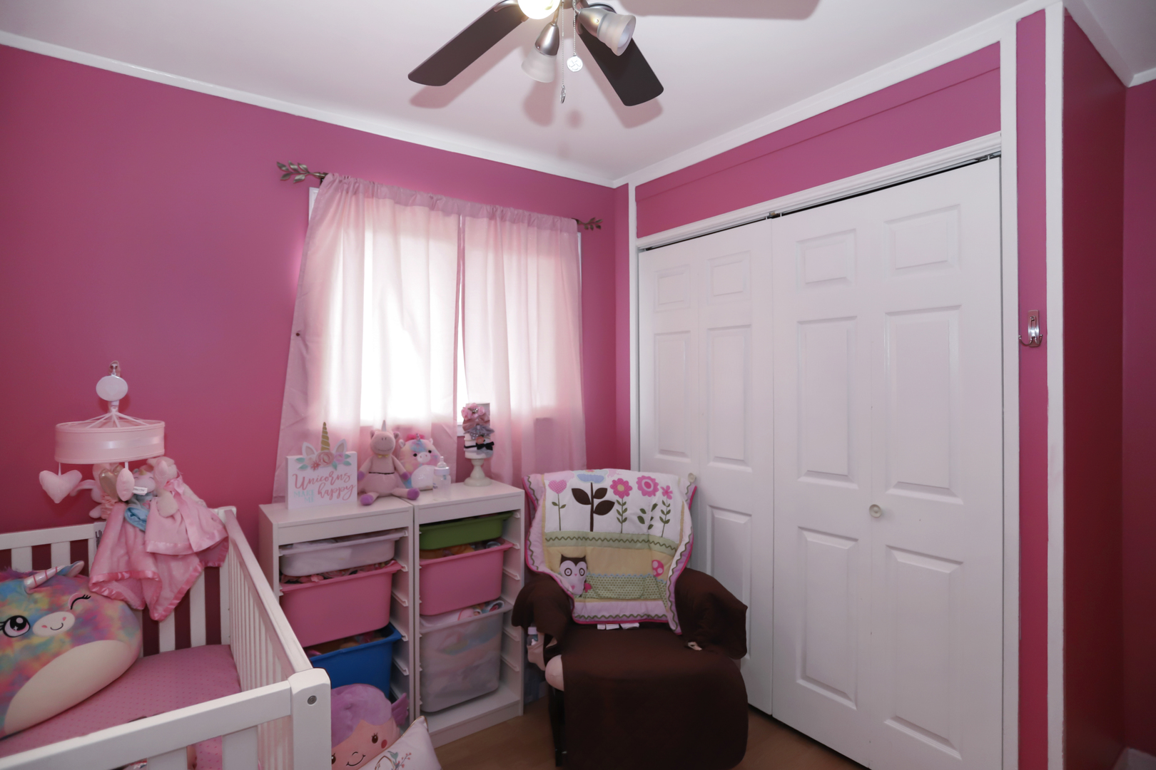116 East Dennis Road Wheeling, IL 60090 - Photo 22 of 28 a room with furniture a chandelier and a window