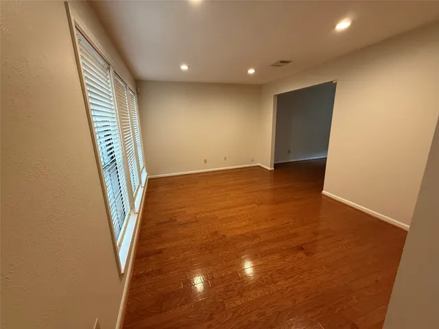 a view of an empty room with stairs