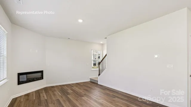 a view of a livingroom with wooden floor