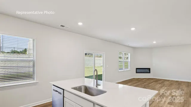 a kitchen with sink and window